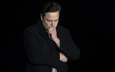 In this file photo taken on February 10, 2022 Elon Musk pauses and looks down as he speaks during a press conference at SpaceX's Starbase facility near Boca Chica Village in South Texas. (Jim Watson/AFP)
