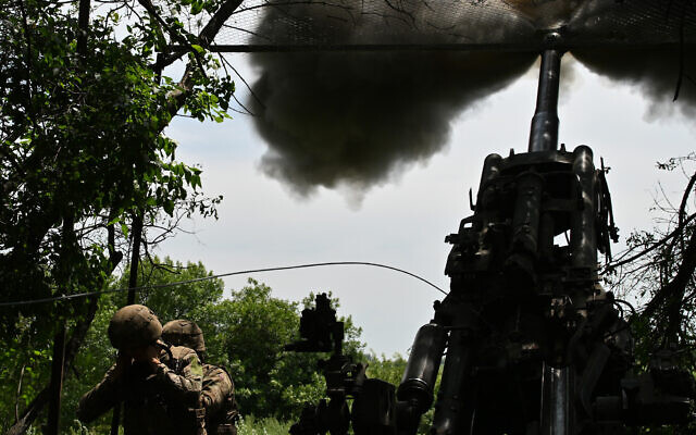 Ukrainian artillerymen fire a howitzer toward Russian positions near Avdiivka in the Donetsk region on June 23, 2023, amid the Russia's invasion of Ukraine. (Genya Savilov/AFP)