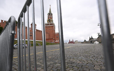 The Spasskaya Tower is seen through metal barriers at Moscow's Red Square on June 24, 2023. (Natalia Kolesnikova/AFP)