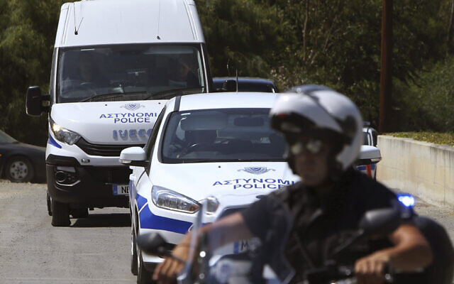 Illustrative -- A motorcyclist police officer escorts and guards a police van, Nicosia, Cyprus, June 24, 2019 (Petros Karadjias/AP)