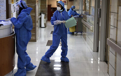 Nurses work in a COVID-19 ward of the Shohadaye Tajrish Hospital in Tehran, Iran, June 16, 2020. (AP Photo/Vahid Salemi)
