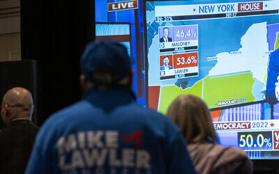 Supporters of Congressional candidate Mike Lawler watch the results on a screen during an election night party, Tuesday, Nov. 8, 2022, in Pearl River, N.Y. (AP/Eduardo Munoz Alvarez)