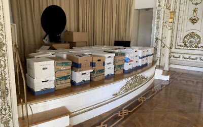 This image, contained in the indictment against former US president Donald Trump, shows boxes of records being stored on the stage in the White and Gold Ballroom at Trump's Mar-a-Lago estate in Palm Beach, Florida. (Justice Department via AP)