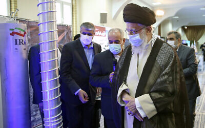 Supreme Leader Ayatollah Ali Khamenei, right, visits an exhibition of Iran's nuclear achievements, at his office compound in Tehran, Iran, June 11, 2023. (Office of the Iranian Supreme Leader, Via AP)