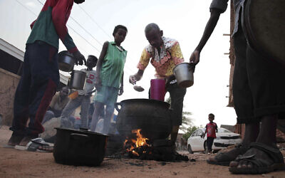File: People prepare food in a neighborhood in Khartoum, Sudan, on June 16, 2023. (AP Photo)