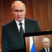 Russian President Vladimir Putin is seen on monitors as he addresses the nation after Yevgeny Prigozhin, the owner of the Wagner Group military company, called for armed rebellion and reached the southern city of Rostov-on-Don with his troops, in Moscow, Russia, June 24, 2023. (Pavel Bednyakov, Sputnik, Kremlin Pool Photo via AP)