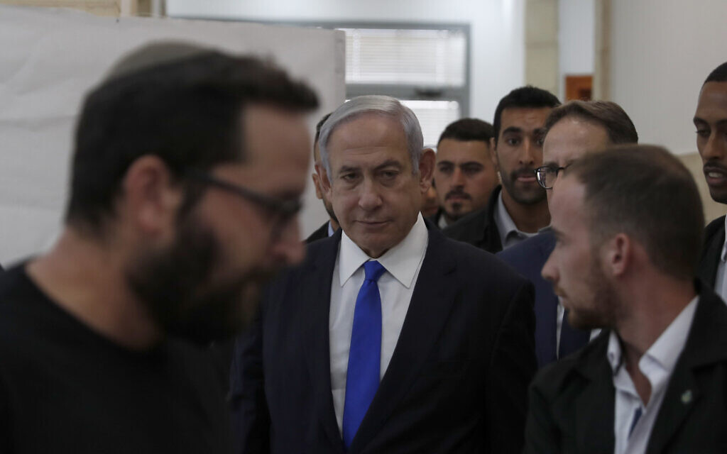 Prime Minister Benjamin Netanyahu, center, arrives at the District Court in Jerusalem, June 25, 2023. (Atef Safadi/ Pool Photo via AP)