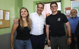Kyriakos Mitsotakis, center, leader of center-right New Democracy party poses for the media with his daughter Dafni Mitsotakis, left, and son Konstantinos Mitsotakis at a polling station in Athens, Greece, June 25, 2023. (AP/ Yorgos Karahalis)