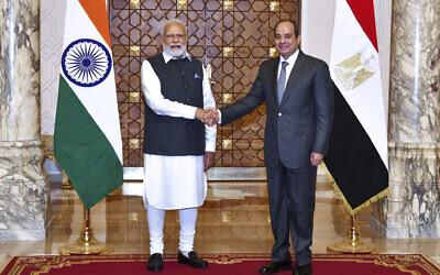 Egyptian President Abdel-Fattah el-Sissi, right, shakes hands with India Prime Minister Narendra Modi in Cairo, Egypt, June 25, 2023. (Egyptian Presidency Media Office via AP)