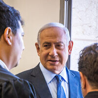 Benjamin Netanyahu arrives for his trial at the District Court in Jerusalem, May 10, 2022 (Oren Ben Hakoon/POOL)