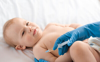 Illustrative image: A baby receives a vaccine (Marina Demidiuk via iStock by Getty Images)