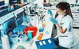 Illustrative image of a scientist in a lab (anyaivanova; iStock by Getty Images)