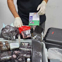 Israel Police examine kits suspected of containing liquid cocaine that UN employees allegedly tried to smuggle into Israel from Jordan on June 25, 2023. (Israel Police)