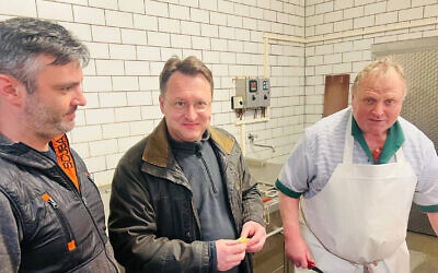 Robert Sesselmann, center, visits a butcher shop in Sonneberg, Germany on April 27, 2023. (Robert Sesselmann)