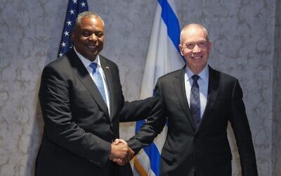 US Defense Secretary Lloyd Austin (L) and Defense Minister Yoav Gallant meet in Brussels on June 15, 2023. (Elad Malcha/Defense Ministry)