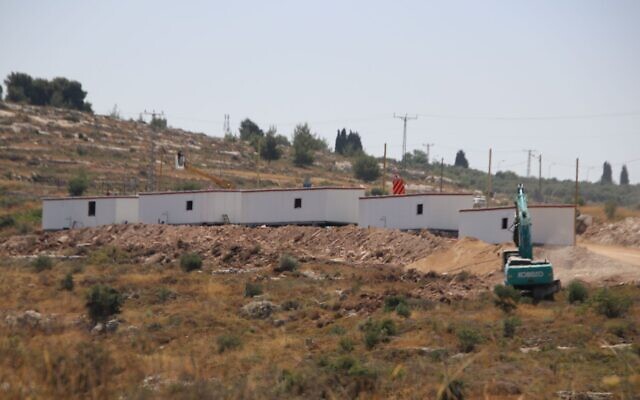 Construction equipment and caravan houses are seen at an illegal outpost built near the West Bank settlement of Maale Levona on June 22, 2023, following a deadly terror attack at a nearby gas station two days before. (Courtesy)