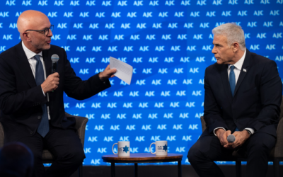 The CEO of the American Jewish Committee, Ted Deutch, left, interviews Israeli opposition leader Yair Lapid on June 11, 2023 in Tel Aviv, Israel. (Courtesy of AJC)