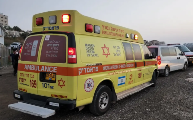 Illustrative: An ambulance is seen at the scene of a deadly crash in Beit Shemesh where a pedestrian was killed after a truck hit him, September 4, 2022. (Magen David Adom)